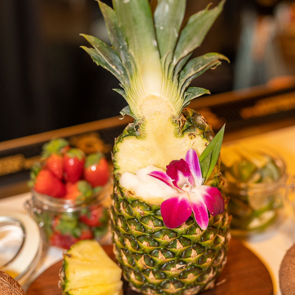 fresh pineapple drink with pink flower