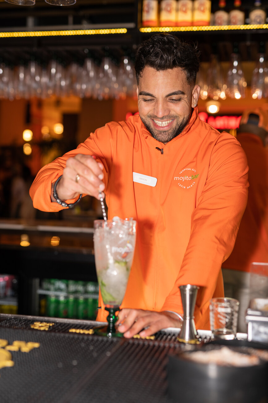 Bartender pouring a fresh mojito